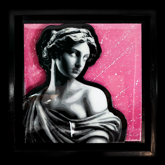 Statue against a pink background with black frame